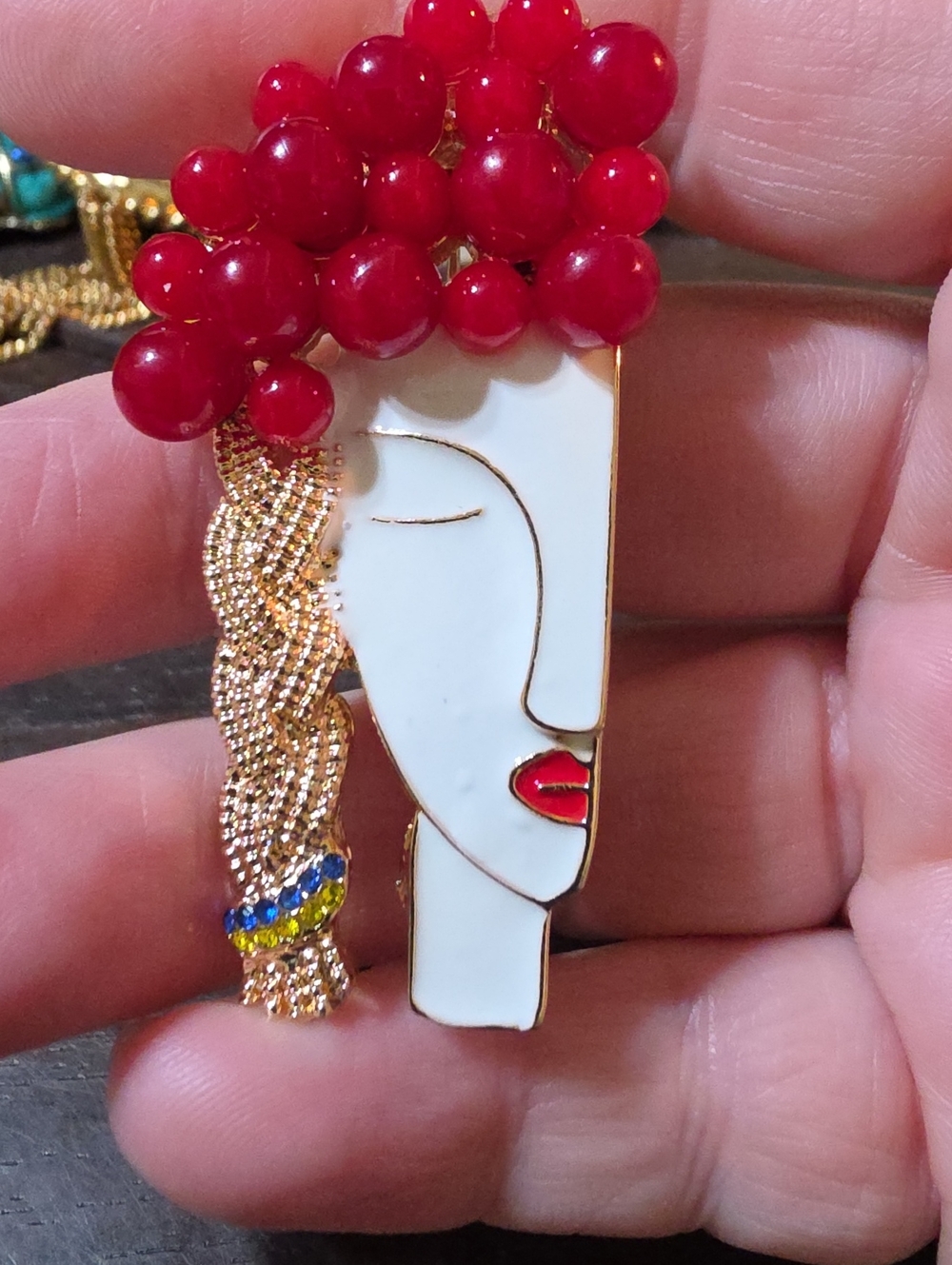 A184- Artistic Face Brooch with Red Bead Accent